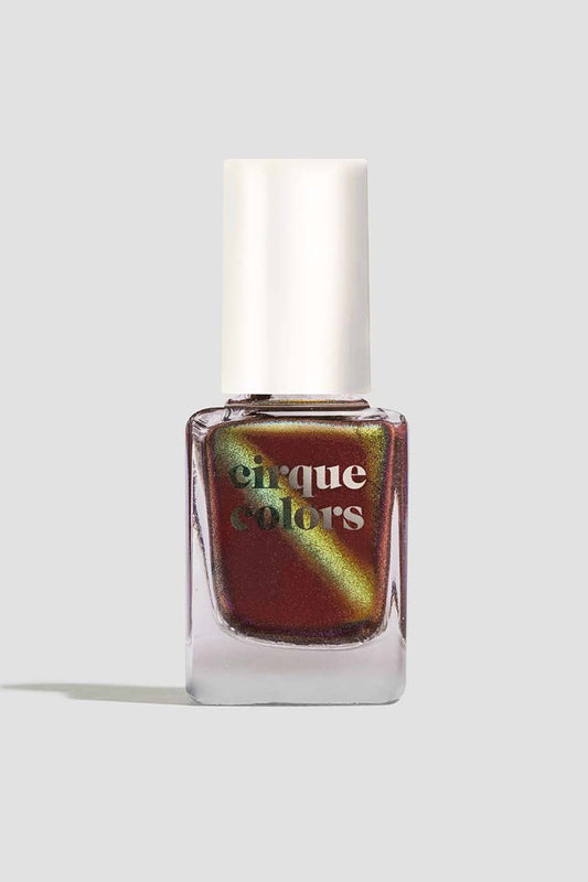 Cirque Colors Delusions of Grandeur bottle – oxblood red magnetic nail polish with bronze, gold, and green multichrome shimmer.