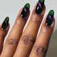 Cirque Colors Folie à Deux forest green magnetic nail polish with magenta-green-gold multichrome effect on nails