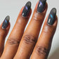 Cirque Colors Wishful Thinking smoke-gray magnetic nail polish with aqua-blue-violet multichrome effect on nails