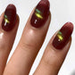 Cirque Colors Delusions of Grandeur oxblood red magnetic multichrome nail polish with bronze, gold, and green shimmer on nails