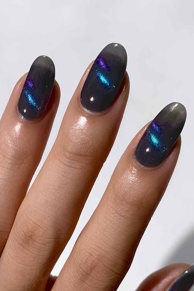 Cirque Colors Wishful Thinking smoke-gray magnetic nail polish with 3D aqua, blue, violet multichrome pigment on nails