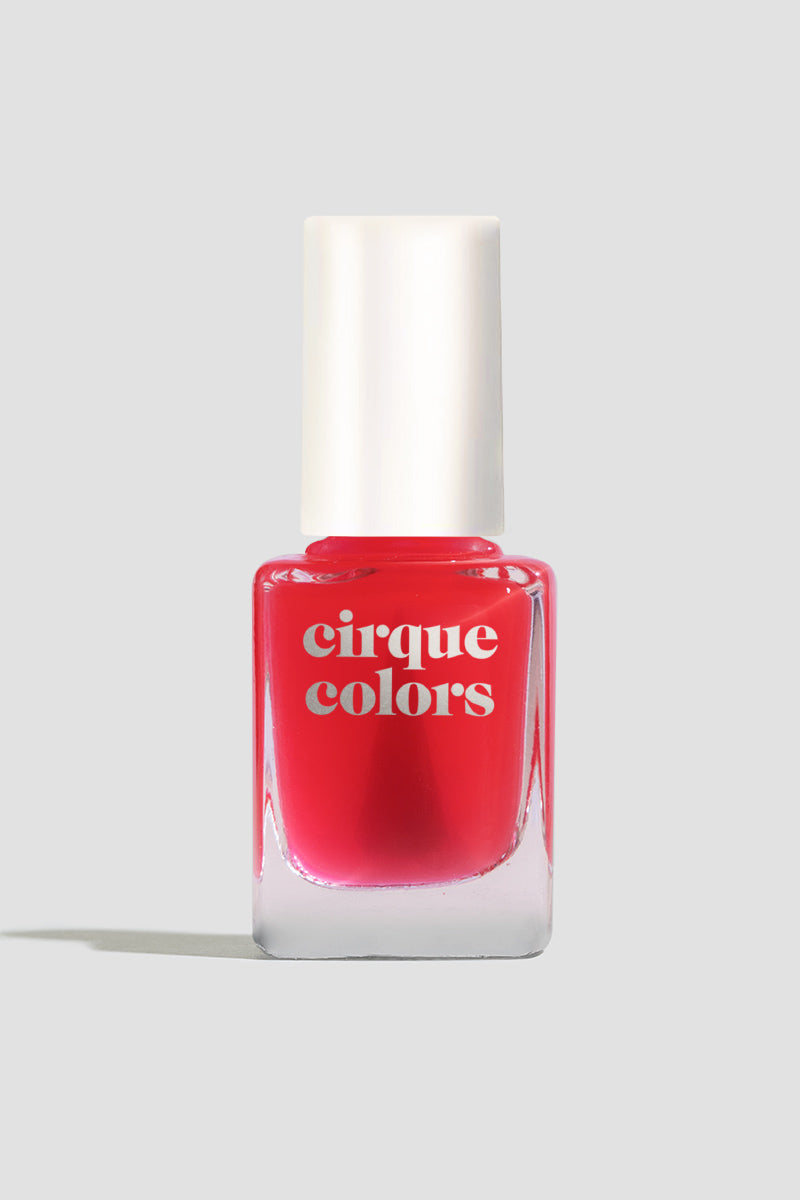 Cirque Colors nail polish bottle featuring Hint Tint: Blush, a clear bright pink-tinted nail polish with a glossy, ultra-transparent finish. This shade enhances your natural nails with a subtle wash of color for a 'my nails but better' look